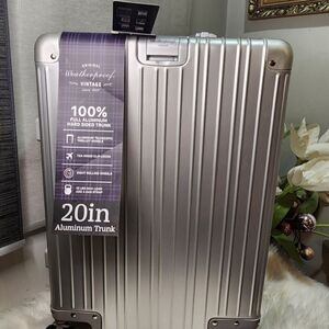 Weatherproof Vintage 20in Aluminum Carry-on LuggageTimeless Elegance: Travel New